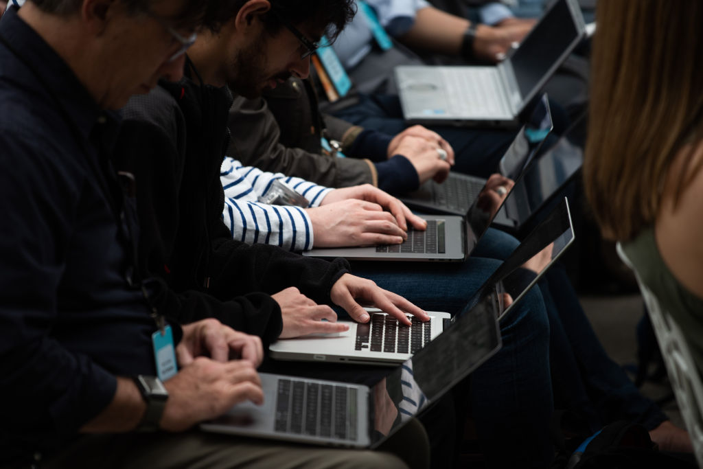 Tech writers take type on laptops during Amazon's release event for new Alexa products and services at The Spheres in Seattle on September 20, 2018. - Amazon weaves its Alexa digital assistant into more services and devices as it unveiles new products powered by artificial intelligence including a smart microwave and dash-mounted car gadget. (Photo by Grant HINDSLEY / AFP)        (Photo credit should read GRANT HINDSLEY/AFP/Getty Images)