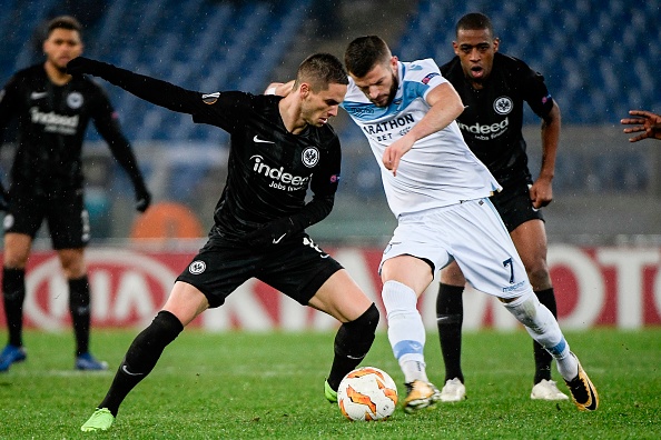 Frankfurt's Serbian midfielder Mijat Gacinovic (L) and Lazio's Kosovo midfielder Valon Berisha go for the ball during the UEFA Europa League group H football match Lazio Rome vs Eintracht Frankfurt on December 13, 2018 at the Olympic stadium in Rome. (Photo by Filippo MONTEFORTE / AFP)        (Photo credit should read FILIPPO MONTEFORTE/AFP/Getty Images)