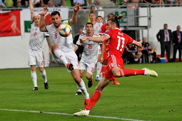 Wales' forward Gareth Bale (R) vies with Hungary's forward Adam Szalai (2nd L) during the UEFA Euro 2020 qualifier Group E football match Hungary against Wales on June 11, 2019 in Budapest. (Photo by ATTILA KISBENEDEK / AFP)        (Photo credit should read ATTILA KISBENEDEK/AFP/Getty Images)