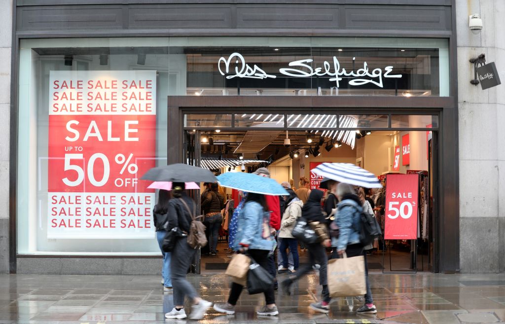 Pedestrians and shoppers walk past a Miss Selfridge store, operated by Arcadia, in London on June 12, 2019. - Landlords and other creditors were on Wednesday set to vote on revised proposals to billionaire Philip Green's Arcadia retail empire, which includes the high-street brands Topshop, Miss Selfridge, Burton, Dorothy Perkins, Evans and Wallis. (Photo by ISABEL INFANTES / AFP)        (Photo credit should read ISABEL INFANTES/AFP/Getty Images)