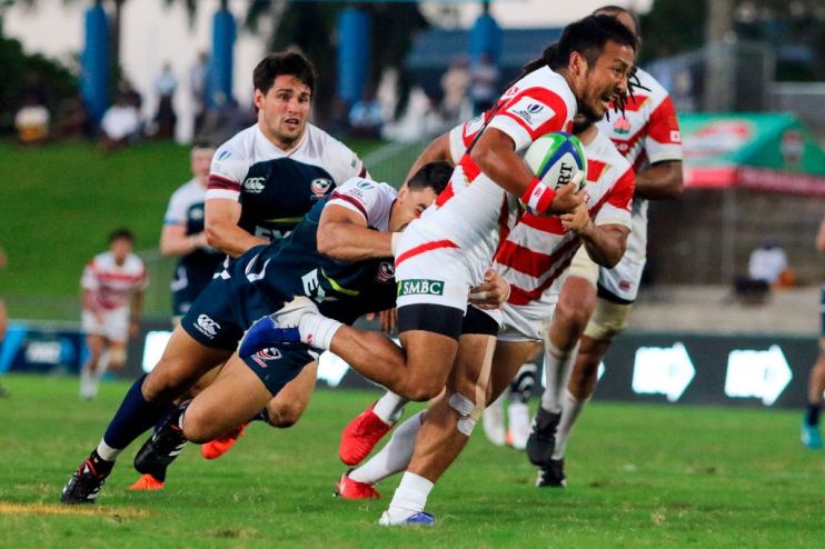 Japan's Yutaka Nagare (R) is tackled by the US Nate Augspurger during their Pacific Nations match in Fiji's capital city Suva on August 10, 2019. (Photo by Lice MOVONO / AFP) (Photo credit should read LICE MOVONO/AFP/Getty Images)