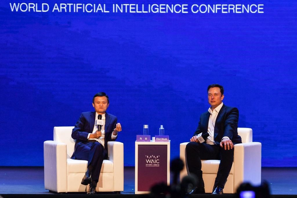 Elon Musk (R), Co-founder and CEO of Tesla, and Jack Ma, co-chair of the UN High-Level Panel on Digital Cooperation, speak onstage during the the World Artificial Intelligence Conference (WAIC) in Shanghai on August 29, 2019. (Photo by HECTOR RETAMAL / AFP)        (Photo credit should read HECTOR RETAMAL/AFP/Getty Images)