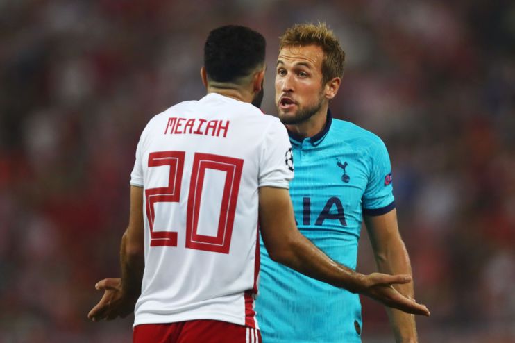 PIRAEUS, GREECE - SEPTEMBER 18: Harry Kane of Tottenham Hotspur clashes with Yassine Meriah of Olympiacos after the awarding of Tottenham Hotspur's first penalty during the UEFA Champions League group B match between Olympiacos FC and Tottenham Hotspur at Karaiskakis Stadium on September 18, 2019 in Piraeus, Greece. (Photo by Dean Mouhtaropoulos/Getty Images)
