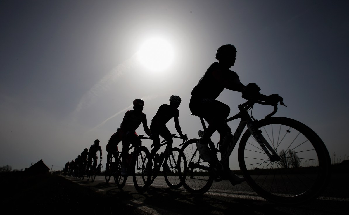 GENT, BELGIUM - MARCH 30:  A general view of the peloton silhouetted against the sun during the Gent-Wevelgem Cycle Race on March 30, 2014 in Gent, Belgium.  (Photo by Dean Mouhtaropoulos - Velo/Getty Images)