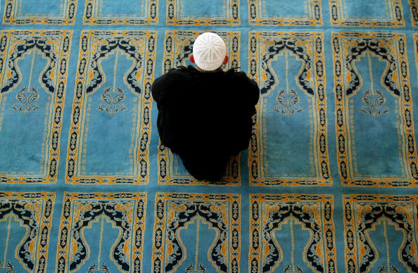 ISTANBUL, TURKEY- FEBRUARY 26:  Turkish men kneel for prayers in a mosque February 26, 2003 in Istanbul, Turkey. Turkey, a secular democracy, is overwhelmingly Muslim and public opinion is steadfastly against an American-led war in Iraq. Turkey's parliament will consider allowing U.S. troops into the country February 27.  (Photo by Chris Hondros/Getty Images)
