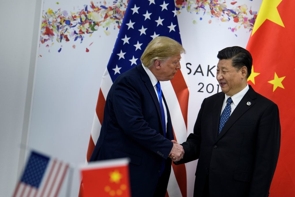 TOPSHOT - China's President Xi Jinping (R) greets US President Donald Trump before a bilateral meeting on the sidelines of the G20 Summit in Osaka on June 29, 2019. (Photo by Brendan Smialowski / AFP)        (Photo credit should read BRENDAN SMIALOWSKI/AFP/Getty Images)