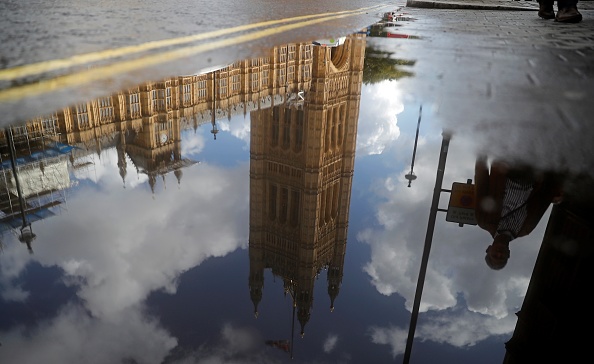 TOPSHOT - The Houses of Parliament are reflected in a puddle of rainwater in central London on September 24, 2019 after the judgement of the court on the legality of Boris Johnson's advice to the Queen to suspend parliament for more than a month, as the clock ticks down to Britain's October 31 EU exit date. - British Prime Minister Boris Johnson on Tuesday said he disagreed with but would respect the Supreme Court ruling which found his decision to suspend parliament unlawful. "I have to say that I strongly disagree with what the justices have found. I don't think that it's right but we will go ahead and of course parliament will come back," he told British broadcasters during a visit to New York. (Photo by Tolga AKMEN / AFP)        (Photo credit should read TOLGA AKMEN/AFP/Getty Images)