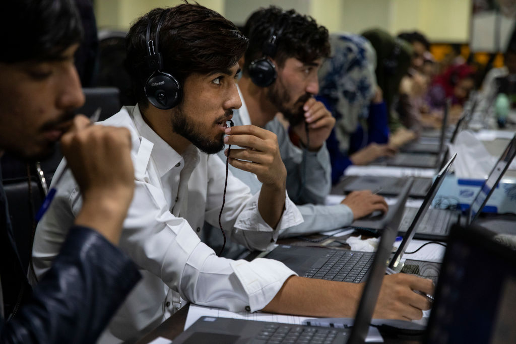 KABUL, AFGHANISTAN - SEPTEMBER 29: Ghani campaign workers answer phone calls in a call center for irregularities from various polling stations at the Ghani headquarters a day after the elections on September 29, 2019 in Kabul, Afghanistan. The country's Interior Ministry said there had been 68 attacks on election sites on Saturday, resulting in three deaths and several dozen wounded, but media reports suggested a higher casualty toll. The threat of violence significantly suppressed turnout, with an estimated two million of nine million registered voters casting ballots. It will be weeks before a final tally, and a runoff between the leading candidates, President Ashraf Ghani and the government's Chief Executive Abdullah Abdullah, is likely. (Photo by Paula Bronstein/Getty Images)
