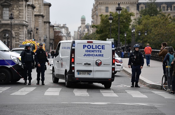 A judicial police vehicle drives toward Paris prefecture de police (police headquarters) after three persons have been hurt in a knife attack on October 3, 2019. - A knife attacker was shot and injured after hurting two people at police headquarters in the historical centre of Paris on October 3, sources told AFP. (Photo by Martin BUREAU / AFP) (Photo by MARTIN BUREAU/AFP via Getty Images)
