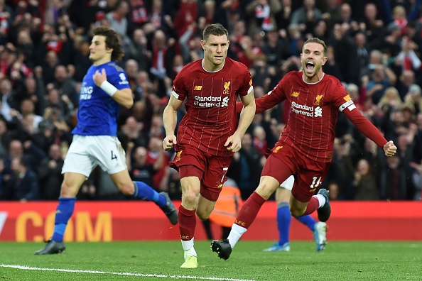 Liverpool's English midfielder James Milner (C) celebrates after he kicks a penalty and scores his team's second goal during the English Premier League football match between Liverpool and Leicester City at Anfield in Liverpool, north west England on October 5, 2019. (Photo by Paul ELLIS / AFP) / RESTRICTED TO EDITORIAL USE. No use with unauthorized audio, video, data, fixture lists, club/league logos or 'live' services. Online in-match use limited to 120 images. An additional 40 images may be used in extra time. No video emulation. Social media in-match use limited to 120 images. An additional 40 images may be used in extra time. No use in betting publications, games or single club/league/player publications. /  (Photo by PAUL ELLIS/AFP via Getty Images)