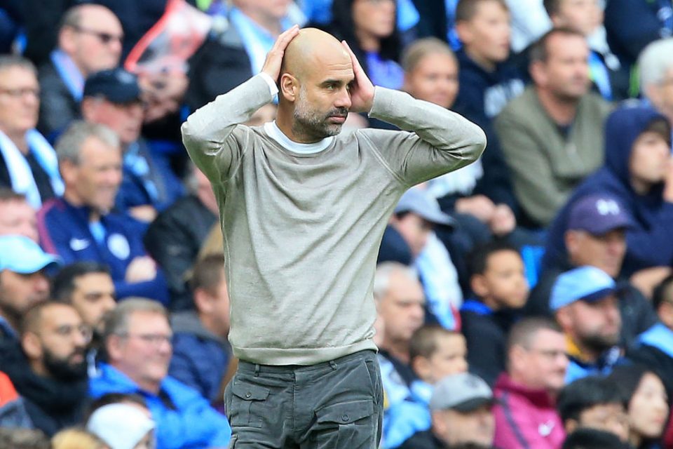 Manchester City's Spanish manager Pep Guardiola reacts during the English Premier League football match between Manchester City and Wolverhampton Wanderers at the Etihad Stadium in Manchester, north west England, on October 6, 2019. (Photo by Lindsey Parnaby / AFP) / RESTRICTED TO EDITORIAL USE. No use with unauthorized audio, video, data, fixture lists, club/league logos or 'live' services. Online in-match use limited to 120 images. An additional 40 images may be used in extra time. No video emulation. Social media in-match use limited to 120 images. An additional 40 images may be used in extra time. No use in betting publications, games or single club/league/player publications. /  (Photo by LINDSEY PARNABY/AFP via Getty Images)