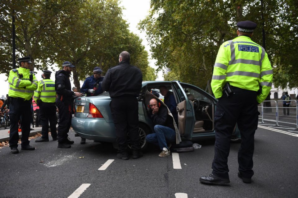 Extinction Rebellion London protests: Police intercept people in a car on Westminster Bridge (Getty)