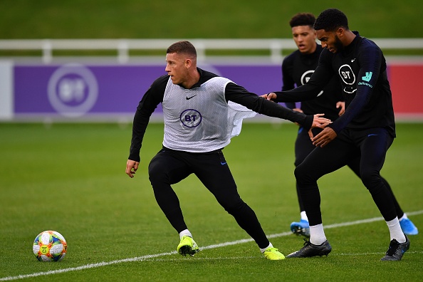 England's midfielder Ross Barkley (L) vies with England's midfielder Jadon Sancho (C) and England's defender Joe Gomez as they attend an England team training session at St George's Park in Burton-on-Trent, central England on October 7, 2019, ahead of their Euro 2020 football qualification match against the Czech Republic. (Photo by Paul ELLIS / AFP) / NOT FOR MARKETING OR ADVERTISING USE / RESTRICTED TO EDITORIAL USE (Photo by PAUL ELLIS/AFP via Getty Images)