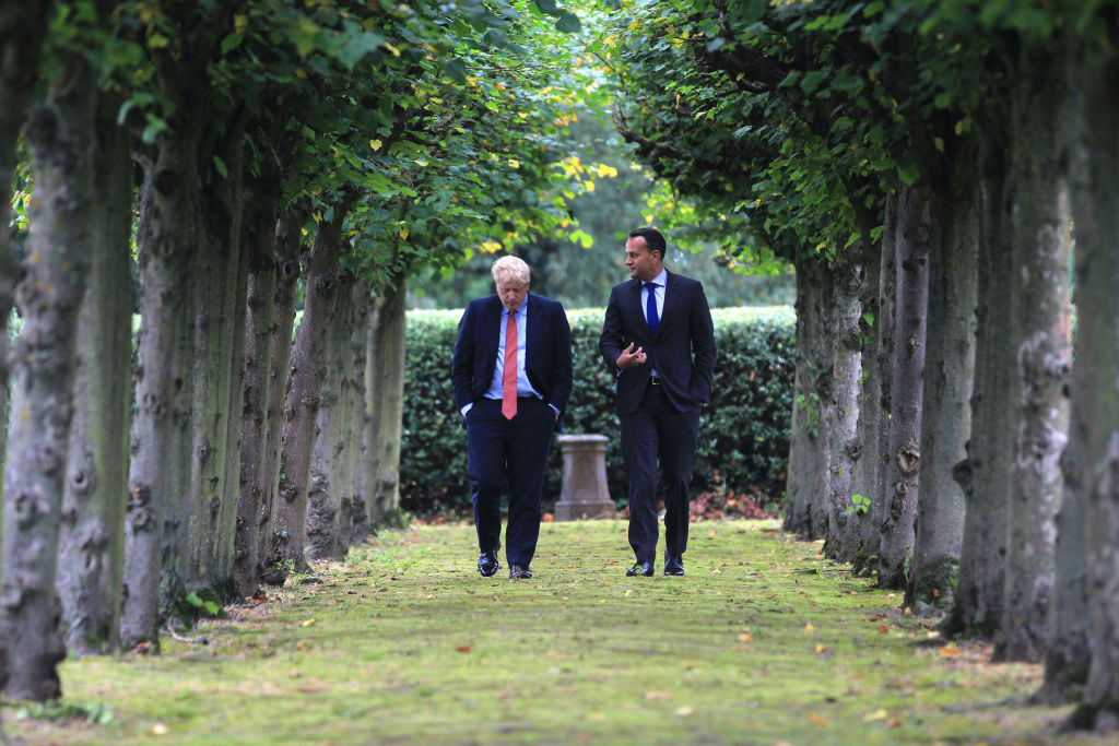 LIVERPOOL, ENGLAND - OCTOBER 10: In this handout image provided by the Irish Government Press Office British Prime Minister Boris Johnson (L) walks with Ireland's Taoiseach Leo Varadkar (R) in the grounds of Thornton Manor Hotel near Birkenhead on October 10, 2019 in Liverpool, England. (Photo by Noel Mullen/ Irish Government Press Office via Getty Images)
