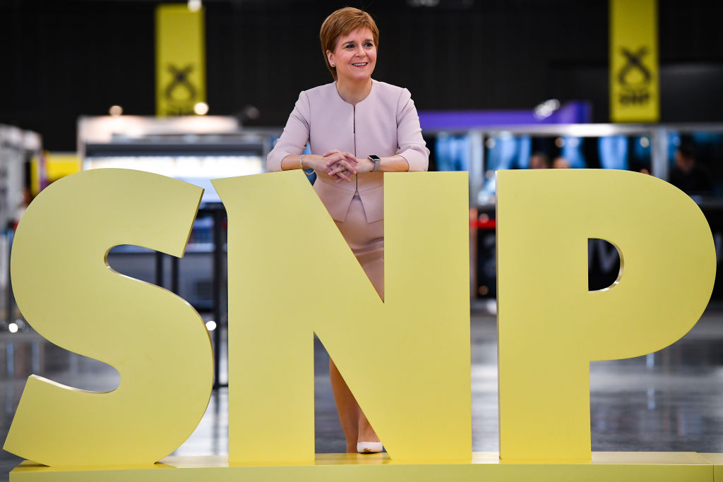ABERDEEN, SCOTLAND - OCTOBER 14: First Minister of Scotland and SNP leader Nicola Sturgeon stands by an SNP sign at the party autumn conference on October 14, 2019 in Aberdeen, Scotland. The SNP’s autumn conference started yesterday at The Event Complex Aberdeen (TECA), party leader Nicola Sturgeon has said her Westminster counterparts should not expect SNP support unless the permit a second independence referendum. (Photo by Jeff J Mitchell/Getty Images)