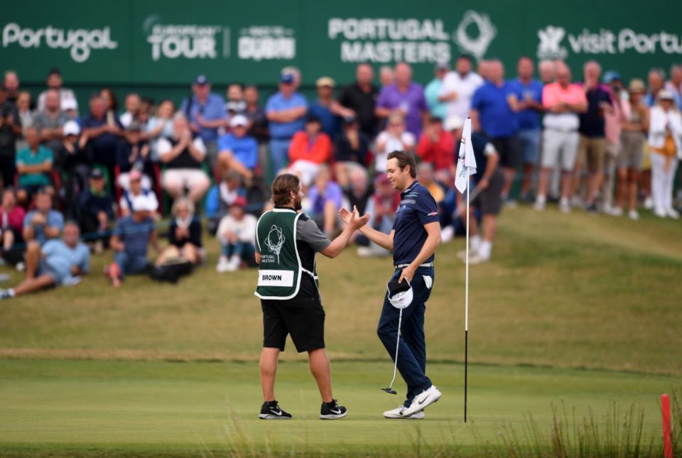 QUARTEIRA, PORTUGAL - OCTOBER 27: Steven Brown of England(R) celebrates with his caddie on the 18th after winning the Portugal Masters during Day Four of the Portugal Masters at Dom Pedro Victoria Golf Course on October 27, 2019 in Quarteira, Portugal. (Photo by Harry Trump/Getty Images)