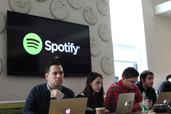 NEW YORK, NY - DECEMBER 11:  Social media bloggers listen as Spotify CEO Daniel Ek announces that the online streaming music service will expand to 20 new markets around the world and that it has worked out a deal with Led Zeppelin, which had so far refused to license its catalog for streaming on the service on December 11, 2013 in New York City. The new markets will include a number of countries in Europe and South and Central America and the music service will now allow free streaming to mobile devices.  (Photo by Spencer Platt/Getty Images)
