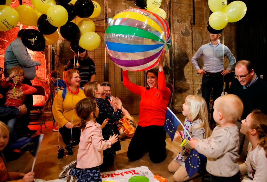 Liberal Democrats leader Jo Swinson poses playing with an large inflatable ball with children after giving a speech at a general election rally in London on November 9, 2019. - Britain goes to the polls on December 12 to vote in a pre-Christmas general election. (Photo by Tolga AKMEN / AFP) (Photo by TOLGA AKMEN/AFP via Getty Images)