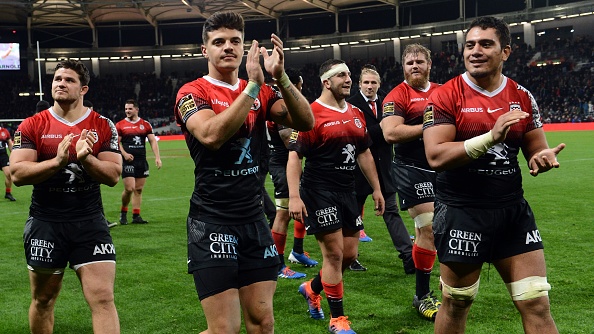 Toulouse's center Romain Ntamack (C) applauds as Toulouse's players celebrate at the end of the French Top 14 rugby union match between Toulouse and Clermont at the municipal stadium in Toulouse, southern France, on November 9, 2019. (Photo by REMY GABALDA / AFP) (Photo by REMY GABALDA/AFP via Getty Images)