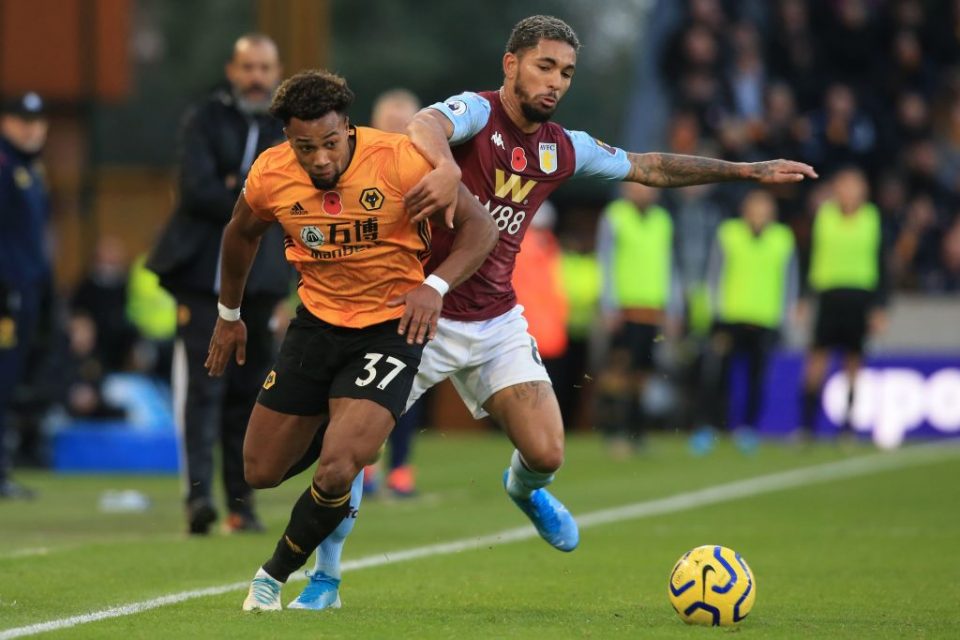 Wolverhampton Wanderers' Spanish striker Adama Traore (L) vies with Aston Villa's Brazilian midfielder Douglas Luiz (R) during the English Premier League football match between Wolverhampton Wanderers and Aston Villa at the Molineux stadium in Wolverhampton, central England  on November 10, 2019. - Wolves won the game 2-1. (Photo by Lindsey Parnaby / AFP) / RESTRICTED TO EDITORIAL USE. No use with unauthorized audio, video, data, fixture lists, club/league logos or 'live' services. Online in-match use limited to 120 images. An additional 40 images may be used in extra time. No video emulation. Social media in-match use limited to 120 images. An additional 40 images may be used in extra time. No use in betting publications, games or single club/league/player publications. /  (Photo by LINDSEY PARNABY/AFP via Getty Images)