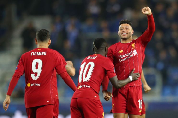 GENK, BELGIUM - OCTOBER 23: Alex Oxlade-Chamberlain of Liverpool celebrates with teammate Sadio Mane after scoring his team's first goal during the UEFA Champions League group E match between KRC Genk and Liverpool FC at Luminus Arena on October 23, 2019 in Genk, Belgium. (Photo by Catherine Ivill/Getty Images)