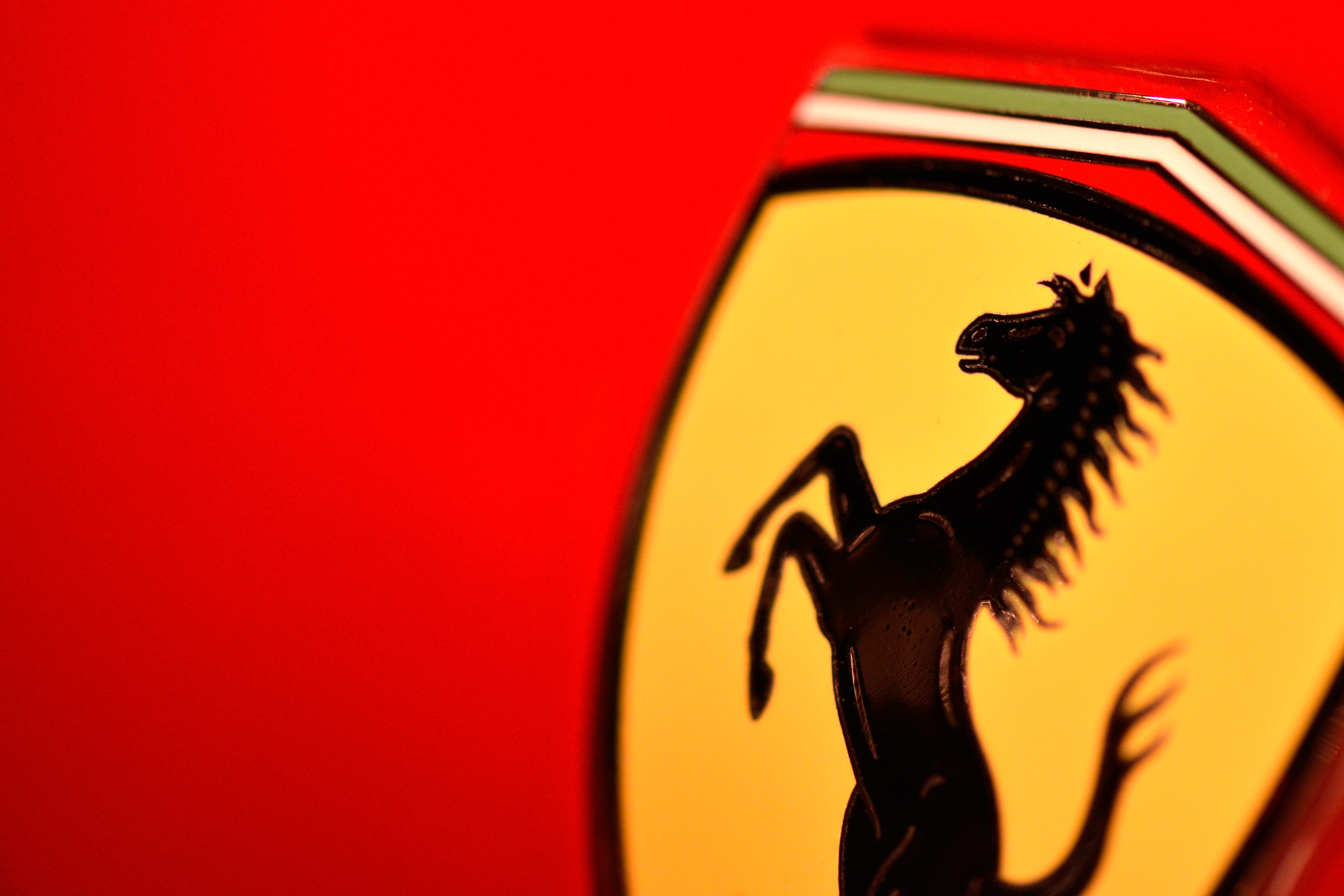 Ferrari's prancing horse gallops on as luxury car maker raises outlook