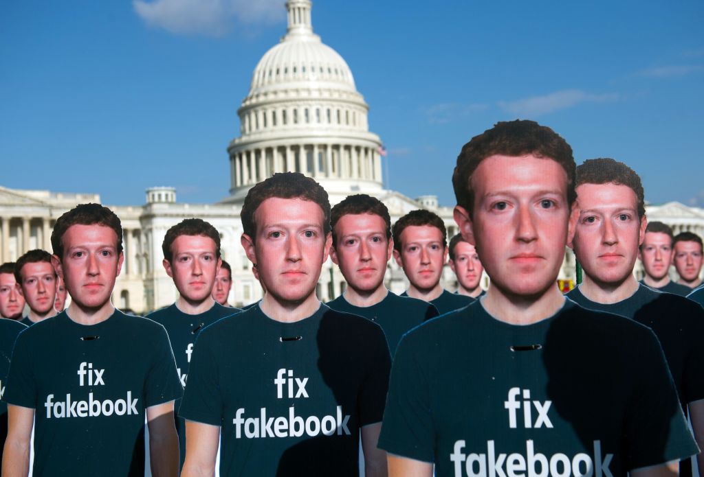 One hundred cardboard cutouts of Facebook founder and CEO Mark Zuckerberg stand outside the US Capitol in Washington, DC, April 10, 2018. - Advocacy group Avaaz is calling attention to what the groups says are hundreds of millions of fake accounts still spreading disinformation on Facebook. (Photo by SAUL LOEB / AFP)        (Photo credit should read SAUL LOEB/AFP via Getty Images)