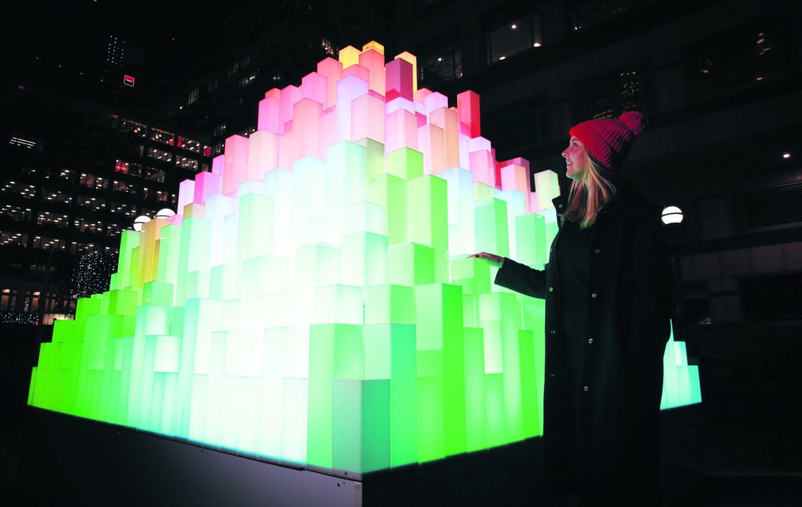 EDITORIAL USE ONLY
Martine Basson interacts with an installation called Mountain of Light by Angus Muir at the annual Canary Wharf Winter Lights festival 2020, London. PRESS ASSOCIATION Photo. Picture date: Wednesday January 15, 2020. The festival sees over 25 installations and immersive experiences by a range of internationally renowned artists set the dark nights aglow. The exhibition is free to the public and runs from 16th January to 25th January 2020 and is free to the public. Photo credit should read: Matt Alexander/PA Wire