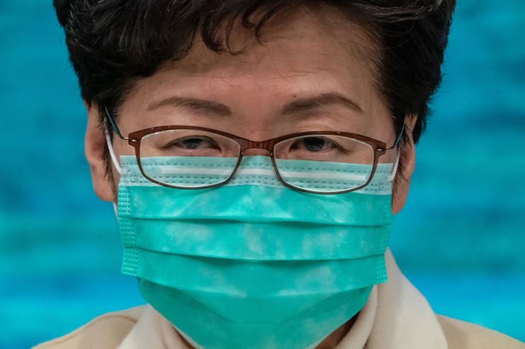 Hong Kong leader Carrie Lam wears a mask to protect against the coronavirus