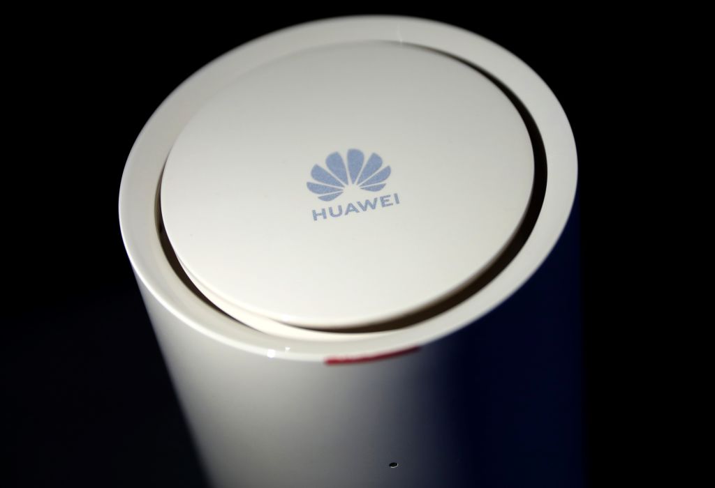A logo is pictured on a Huawei router during a 5G event in London,