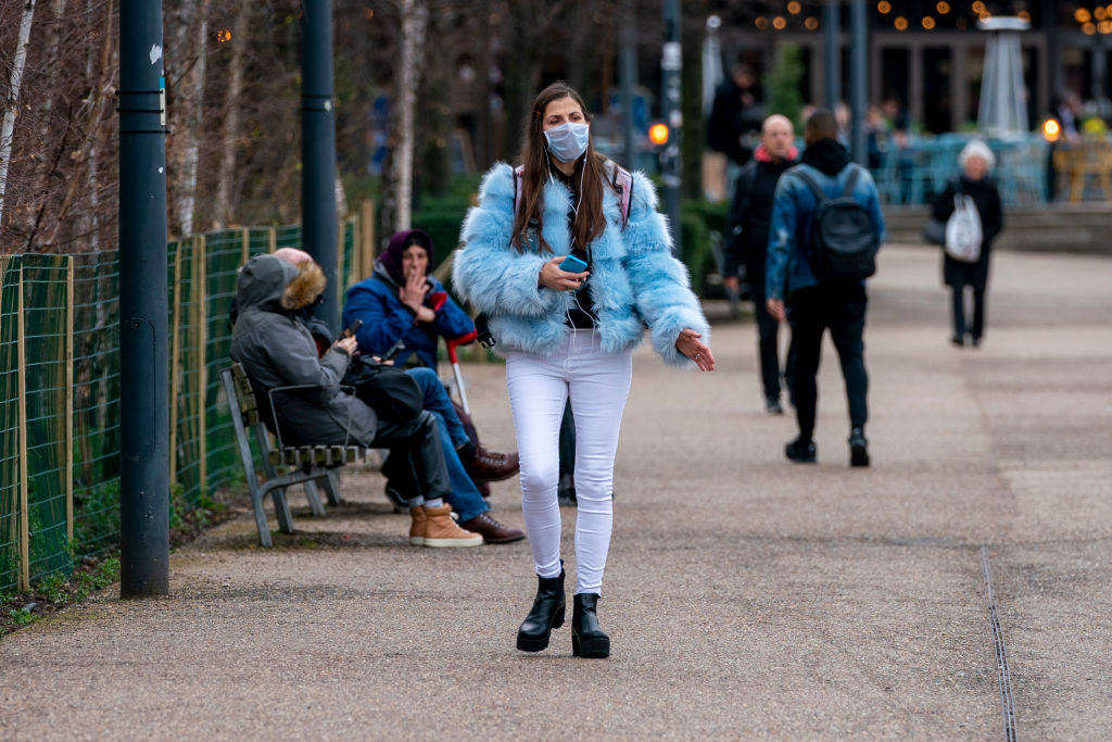 Members of the public wear surgical masks to protect themselves from coronavirus