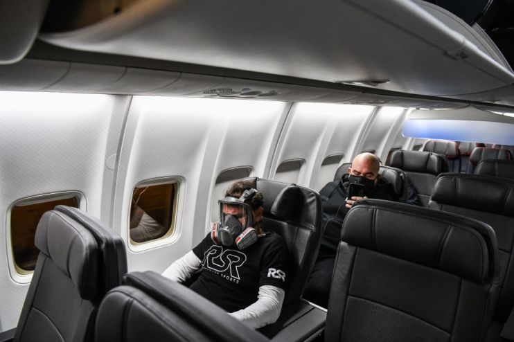 Man wears face mask on airline