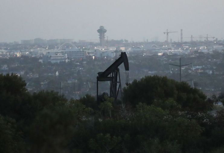 Global oil prices slipped today after US crude stocks breached all-time highs after an unexpected surge in demand.
