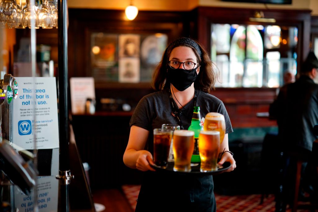 Wetherspoon bar staff are wearing face masks and other PPE to serve customers enjoying a pint, though alcohol is not covered by the VAT cut