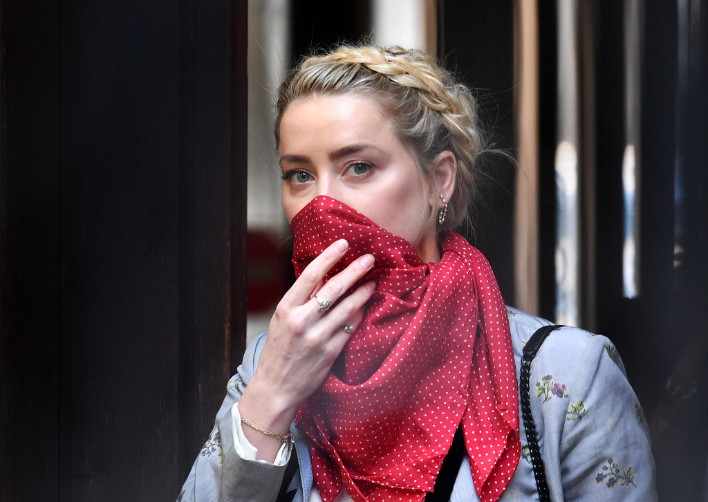 Amber Heard admits punching ex-husband Johnny Depp during heated row ...