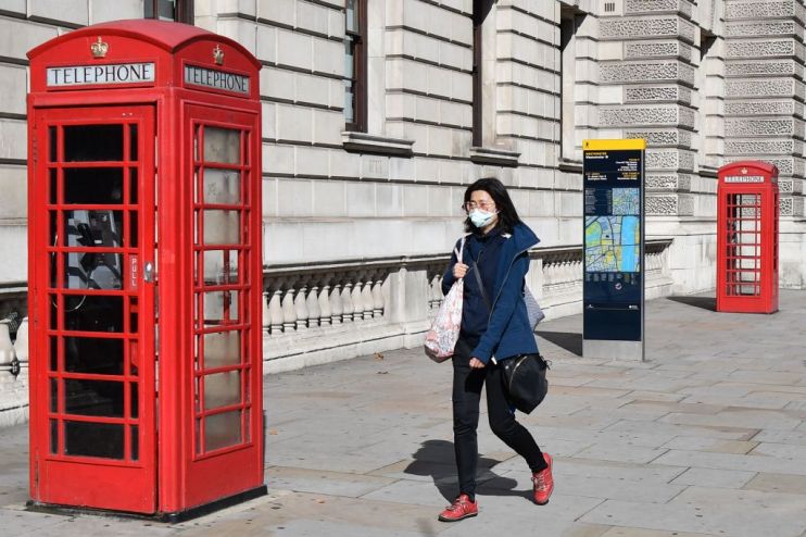 BRITAIN-HEALTH-CORONAVIRUS-RESTRICTIONS