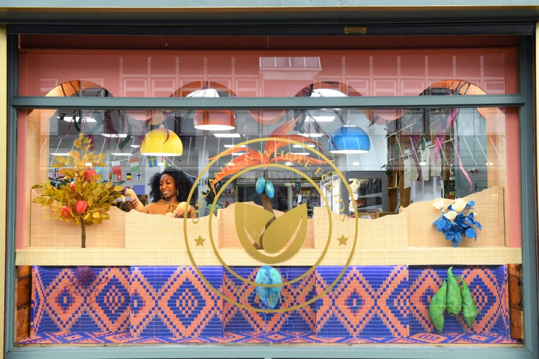 Kiera-Lorelle, co-owner of organic food hall Cinnamon Leaf at the unveiling of a new shop front, created by renowned window designer Petra Storrs, as Facebook launches a campaign to support female-owned businesses across the UK