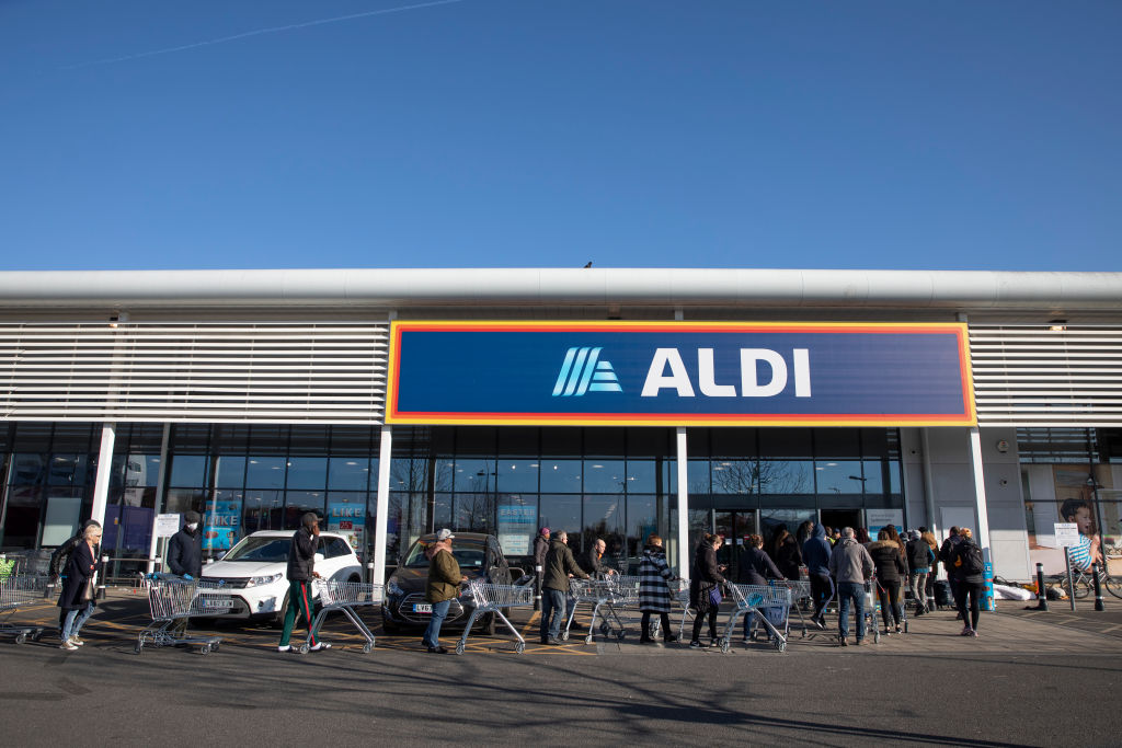 LONDON, ENGLAND - MARCH 23: Shoppers queue outside an Aldi supermarket on March 23, 2020 in London, England. (Photo by Dan Kitwood/Getty Images)