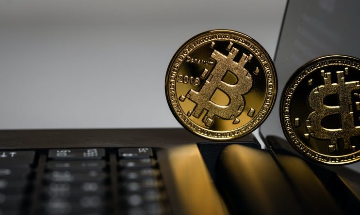 Bitcoin on keyboard - photo by Aleksi R&auml;is&auml; on Unsplash