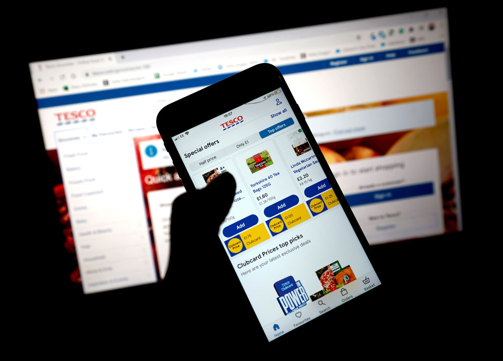 LONDON, ENGLAND - JANUARY  11: In this photo illustration, the grocery shopping app for Tesco is seen on a mobile phone on January 11, 2021 in London, United Kingdom. (Photo by Edward Smith/Getty Images)