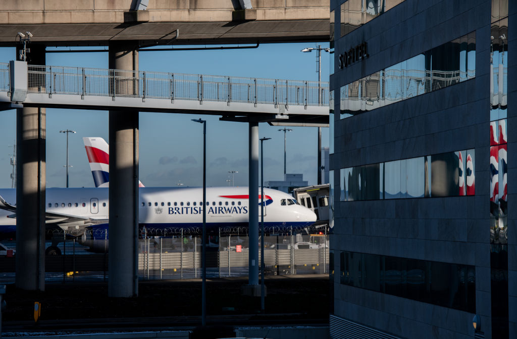 LONDON, ENGLAND - JANUARY 25: British Airways airplanes are seen behind a Sofitel hotel at Heathrow Airport