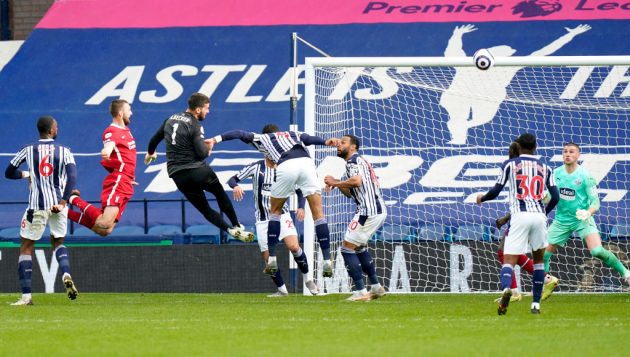 Liverpool goalkeeper Alisson's sensational injury-time header kept them hot on the heels of Chelsea for a Champions League place