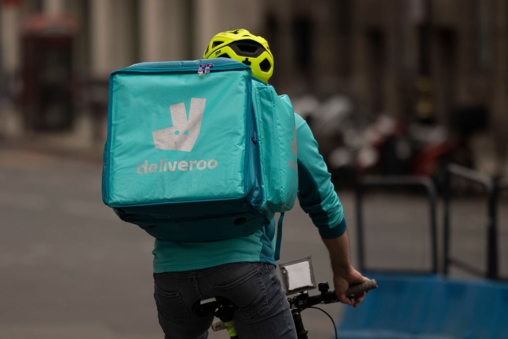 A Deliveroo rider near Victoria station in London. (Photo by Dan Kitwood/Getty Images)
