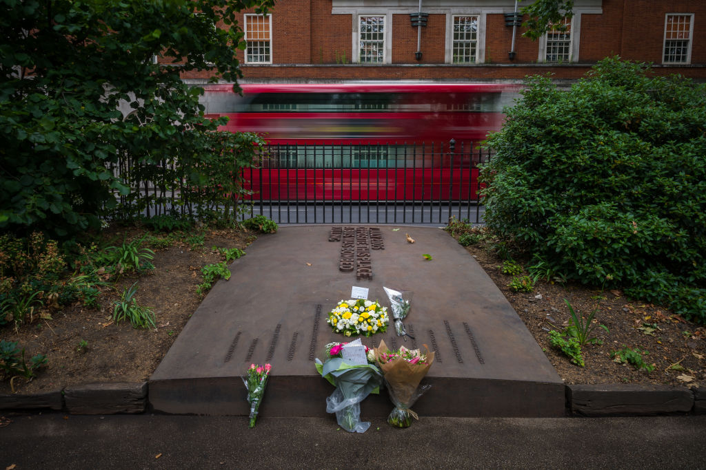 LONDON, ENGLAND - JULY 07: Floral tributes are seen on the Tavistock Square Garden Memorial, near to where a bomb was detonated on a bus killing 13 people, as events are held to mark the fifteenth anniversary of the London bombings, on July 07, 2020 in London, England. 56 People died and 700 people were injured when four devices were detonated by Islamist terrorist across the London transport network.  Three went off on the underground and one on a double decker bus.  (Photo by Leon Neal/Getty Images)