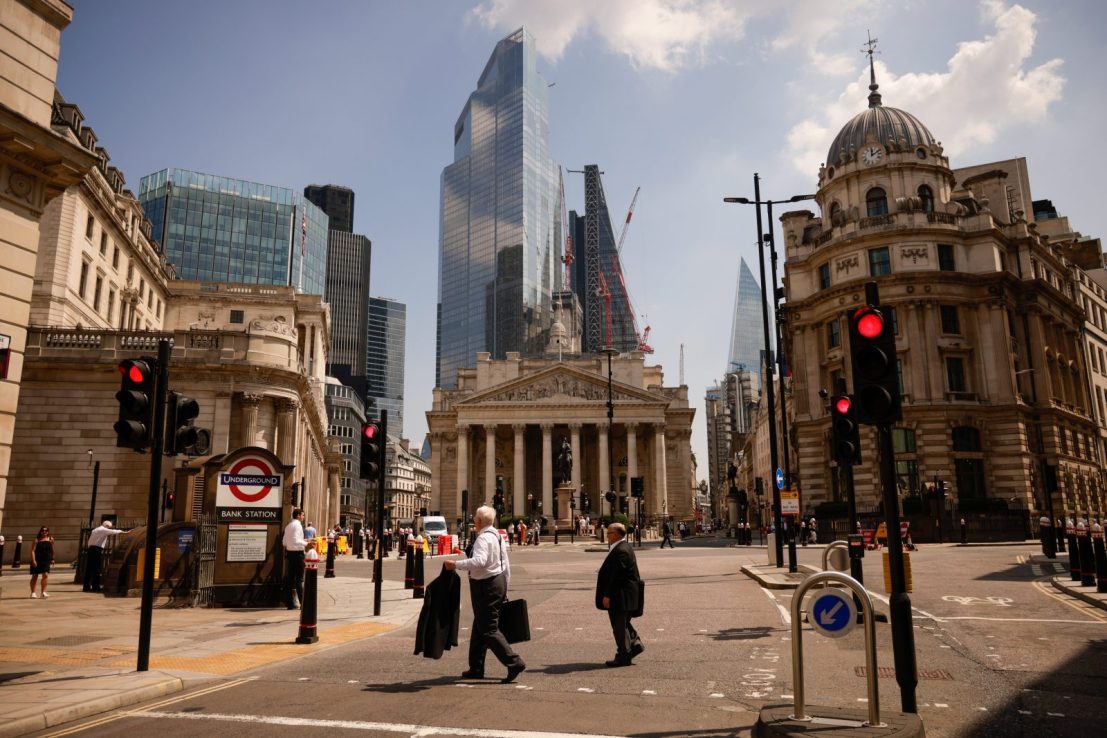Pedestrians walk in the City of London, (Getty Images)