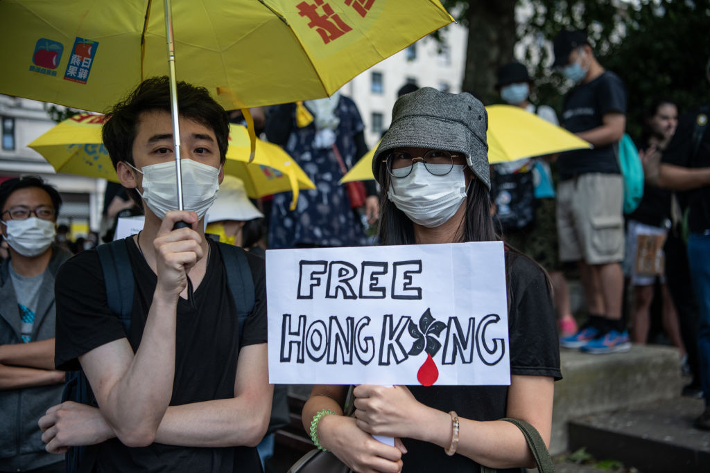 Protesters attend a rally for Hong Kong democracy at the Marble Arch on June 12, 2021 in London, England. (Photo by Laurel Chor/Getty Images)