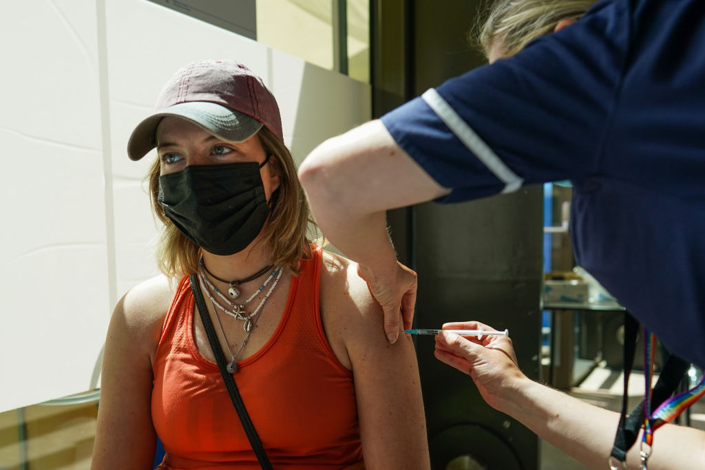 A young woman receiving a Pfizer jab from a walk-in vaccine site in Newcastle upon Tyne (Photo by Ian Forsyth/Getty Images)