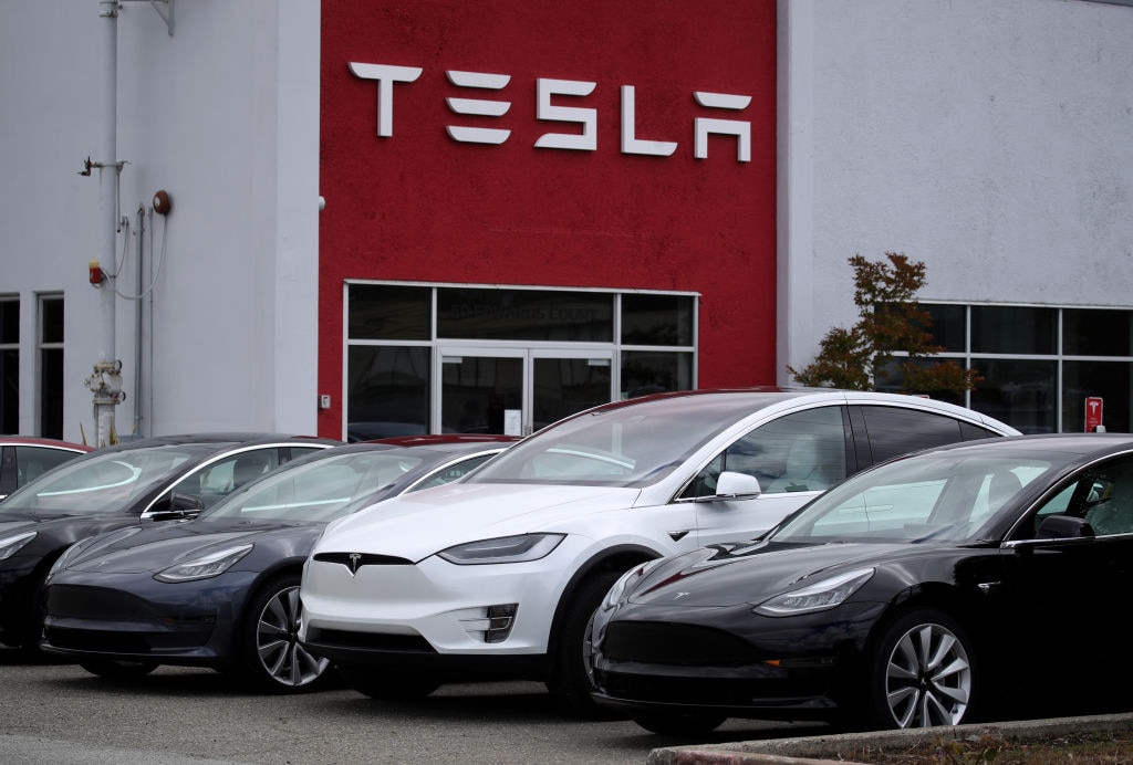 Electric carmaker Tesla posted record vehicle deliveries for the second quarter as the firm handled the worldwide semiconductor shortage through sales of its cheaper models.