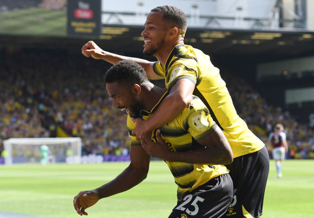 The logo of cryptocurrency Dogecoin appears on the shirt sleeves of Watford players as part of a sponsorship deal with the Premier League club