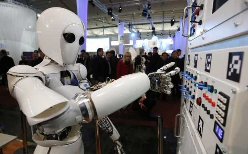 The British government will spend more than £100m building artificial intelligence (AI) research hubs and preparing regulators.